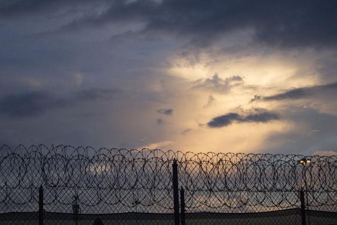 barbed wire fence and sunset